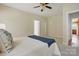 Neutral bedroom with ceiling fan and view to the hallway at 2805 Sadler Rd, Alexis, NC 28006