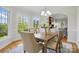 Bright dining room with natural light, hardwood floors, and stylish chandelier at 2805 Sadler Rd, Alexis, NC 28006