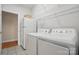 Functional laundry room featuring appliances and shelving at 2805 Sadler Rd, Alexis, NC 28006