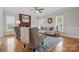 Cozy living room featuring a brick fireplace, wood floors, and stylish furniture at 2805 Sadler Rd, Alexis, NC 28006