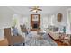 Bright living room featuring a fireplace with brick surround and a stylish area rug at 2805 Sadler Rd, Alexis, NC 28006