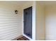 Charming front door with a security screen, decorative glass and modern outdoor lighting at 3210 Selwyn Farms Ln # 7, Charlotte, NC 28209