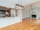 Open concept living room with stainless steel appliances, hardwood floors and granite countertops at 3210 Selwyn Farms Ln # 7, Charlotte, NC 28209