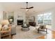 Bright living room features a fireplace, built-in shelving, and sliding doors to an outdoor deck at 3210 Selwyn Farms Ln # 7, Charlotte, NC 28209