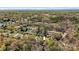 Aerial view of the property highlighting its location within a lush, wooded neighborhood at 3846 22Nd Ne St, Hickory, NC 28601