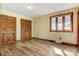 Cozy bedroom with wood floors and large window providing natural light at 3846 22Nd Ne St, Hickory, NC 28601