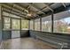 Relaxing screened porch with wooded views, a ceiling fan, and space to enjoy the outdoors at 3846 22Nd Ne St, Hickory, NC 28601
