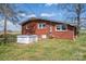 Brick home with well-maintained lawn and an external cellar door at 396 Tower Rd, Vale, NC 28168