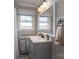 Bathroom featuring a single vanity, a framed mirror, and a window at 396 Tower Rd, Vale, NC 28168