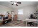 Bedroom with wood-look floors, ceiling fan, and natural light from the window at 396 Tower Rd, Vale, NC 28168