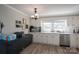 The kitchen has white cabinets, stainless steel appliances, and marble countertops at 396 Tower Rd, Vale, NC 28168