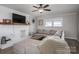 The living room has hardwood floors, a fireplace, a ceiling fan, and a large sectional sofa at 396 Tower Rd, Vale, NC 28168