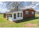 The sunroom has white walls, and the house is brick, providing abundant natural light at 396 Tower Rd, Vale, NC 28168