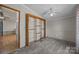 Bedroom featuring a closet, window with curtains, ceiling fan and carpet at 404 Forest Winds Dr, Salisbury, NC 28144