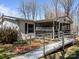 Close-up view of a single-story home featuring a screened porch and wheelchair ramp at 404 Forest Winds Dr, Salisbury, NC 28144