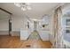 The kitchen features white cabinets, laminate countertops, and wood-look floors at 404 Forest Winds Dr, Salisbury, NC 28144