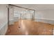 Open-concept living room features neutral paint, wood-look floors, and a ceiling fan at 404 Forest Winds Dr, Salisbury, NC 28144