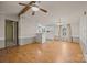 The living room features wood-look floors and opens to the kitchen with white cabinets at 404 Forest Winds Dr, Salisbury, NC 28144