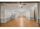 Open living room features wood-look floors and a ceiling fan at 404 Forest Winds Dr, Salisbury, NC 28144