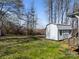 Backyard view of the outbuilding with metal roof, windows and painted siding at 404 Forest Winds Dr, Salisbury, NC 28144