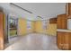 Spacious room with yellow walls, laminate flooring, and wooden cabinets at 404 Forest Winds Dr, Salisbury, NC 28144