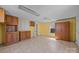 Spacious room featuring yellow walls, laminate flooring, wooden cabinets, and closet at 404 Forest Winds Dr, Salisbury, NC 28144