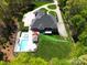 Areal view showing luxurious backyard oasis with a swimming pool, spa, and cabana at 4071 King Wilkinson Rd, Lincolnton, NC 28092