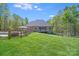 Secluded backyard featuring an in-ground pool, large lawn, and mature trees at 4071 King Wilkinson Rd, Lincolnton, NC 28092