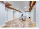 Finished basement with a ping pong table, game machine, unique ceiling, and barn doors at 4071 King Wilkinson Rd, Lincolnton, NC 28092