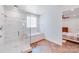 Bright white bathroom featuring walk-in shower, soaking tub, and stylish tiling at 4071 King Wilkinson Rd, Lincolnton, NC 28092