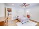 Bright bedroom with tile floor, ceiling fan, ensuite, neutral decor and generous natural light at 4071 King Wilkinson Rd, Lincolnton, NC 28092