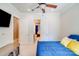 Bedroom featuring a queen bed, ceiling fan and two doorways at 4071 King Wilkinson Rd, Lincolnton, NC 28092
