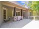 Covered deck with stone pillars, offering a cozy outdoor space for relaxing or grilling at 4071 King Wilkinson Rd, Lincolnton, NC 28092