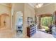 Grand foyer with hardwood floors, arched doorway, and view into the dining area at 4071 King Wilkinson Rd, Lincolnton, NC 28092