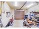 Spacious garage featuring an automatic door and containing yard maintenance equipment at 4071 King Wilkinson Rd, Lincolnton, NC 28092