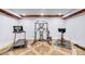 Home gym with hardwood accent ceiling, treadmill, cycle, and multi-station weight machine at 4071 King Wilkinson Rd, Lincolnton, NC 28092