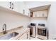 Laundry room featuring a washer, dryer, countertop and cabinets for storage at 4071 King Wilkinson Rd, Lincolnton, NC 28092
