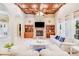 Expansive living room featuring a stone fireplace, built-in shelving, and ample seating at 4071 King Wilkinson Rd, Lincolnton, NC 28092