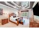 Luxurious main bedroom featuring a decorative tray ceiling, and neutral color palette at 4071 King Wilkinson Rd, Lincolnton, NC 28092