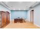 A well lit, spacious home office with a unique metal ceiling and gorgeous wood furnishings at 4071 King Wilkinson Rd, Lincolnton, NC 28092