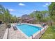 Inviting backyard oasis with a sparkling pool, spa, and ample seating for entertaining guests at 4071 King Wilkinson Rd, Lincolnton, NC 28092