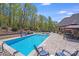 Stunning backyard with a large swimming pool, spa, and multiple seating areas, perfect for outdoor gatherings at 4071 King Wilkinson Rd, Lincolnton, NC 28092