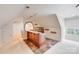 Attic living space featuring a wet bar area with granite countertops at 4071 King Wilkinson Rd, Lincolnton, NC 28092