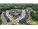 An aerial view of a newly constructed townhome community with beautiful landscaping and ample parking at 408 Moondance Dr # C, Gastonia, NC 28054