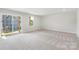 Spacious basement featuring neutral carpet, bright light, and sliding glass doors to the outside at 408 Moondance Dr # C, Gastonia, NC 28054