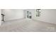 Large basement featuring neutral carpet, sliding glass doors, and ample space to enjoy at 408 Moondance Dr # C, Gastonia, NC 28054
