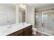 Bathroom featuring double sinks, a glass shower stall, and a separate toilet at 408 Moondance Dr # C, Gastonia, NC 28054