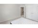 A bedroom featuring neutral walls, plush carpet, and closet with double doors at 408 Moondance Dr # C, Gastonia, NC 28054