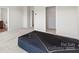 Bedroom featuring neutral walls and carpet and walk-in closet with wire shelving at 408 Moondance Dr # C, Gastonia, NC 28054