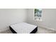 A bright bedroom with a window and a mattress on the floor at 408 Moondance Dr # C, Gastonia, NC 28054